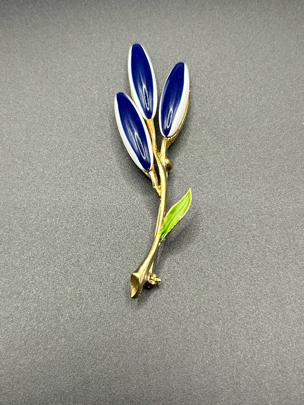 Gold Branch Brooch with Navy Enamel Petals and Green Leaf